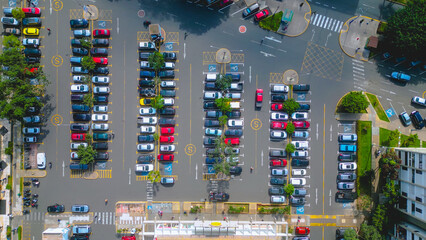 Top‑Down Drone View of a Colorful Car Parking Lot Full of Vehicles.