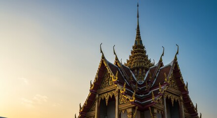 Fototapeta premium Stunning Golden Temple Roofline Against a Clear Sky