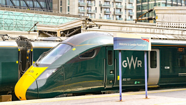 London, England, UK - 4 July 2025: Closeup view of a Great Western Railway GWR Class 800 high speed train and the station name sign on platforms London Paddington railway station. 