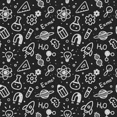 Vector illustration of science and education doodles in seamless hand drawn pattern on chalkboard background.
