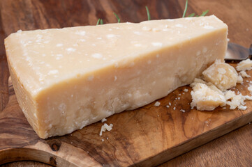 Traditional italian food, 36 months aged in caves Italian hard cheese grana padano from Po river...