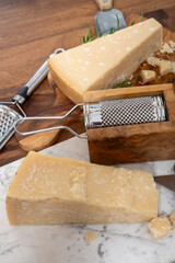 Traditional italian food, 36 months aged in caves Italian parmesan hard cheese from Parmigiano-Reggiano, Italy