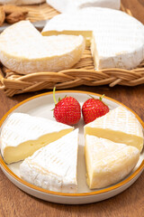 French soft cheeses collection, creamy cow's milk cheese le paysan and brie with white mold, France