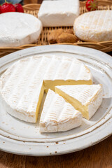 French soft cheeses collection, creamy cow's milk cheese brie with white mold, France