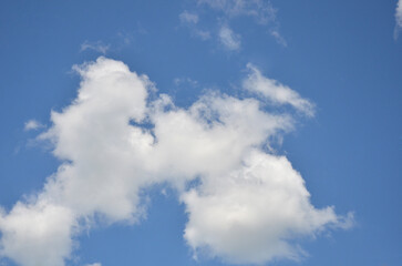 Deep blue sky with white cumulus clouds. .Sky in sunny day , peaceful sky landscape.