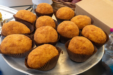 Arancini Sicilian, deep-fried rice balls made with risotto, filled with ingredients mozzarella, ragu, peas, coated in breadcrumbs fried to crispy, brown on market in Palermo, Sicily