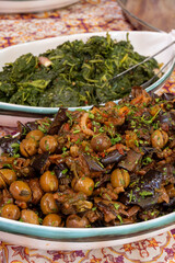 Homemade italian dish caponata with eggplants and pickled green olives with garlic and spices on food market in Palermo, Sicily, italy