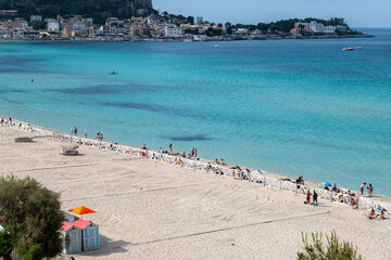 Sunny day on seaside vacation destination, Mondello Beach, near Palermo in Sicily with fine, golden...