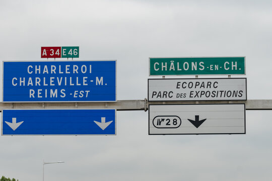 Driving in summer on highway and road signs direction to Reims and other French cities, different types or roads in France, transportation and traffic - Powered by Adobe