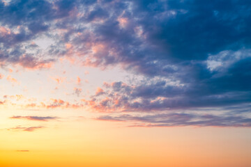 dramatic sky at sunset with a mix of purple, orange and blue hues. Skyscape