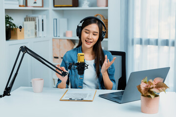 Host channel Asian influencer talking in broadcast streaming online wearing headset on social media...