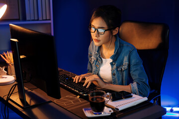 Thinking young beautiful Asian creative woman analyzing profit of sales target report comparing on...
