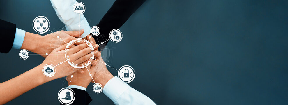 This image illustrates a concept of teamwork and collaboration with diverse hands coming together, symbolizing unity and trust in a professional setting. Amity