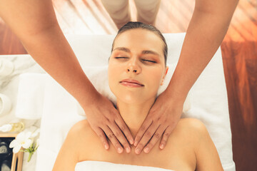 Naklejka premium Panorama top view woman customer enjoying relaxing anti-stress spa massage and pampering with beauty skin recreation leisure in day light ambient salon spa at luxury resort or hotel. Quiescent