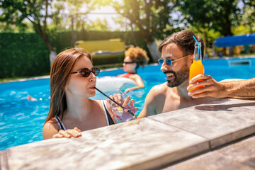 Summer Pool Party with Friends and Colorful Cocktails