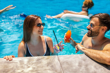 Summer Pool Party with Friends and Colorful Cocktails