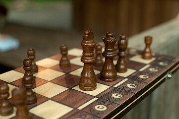 Chess pieces are arranged on a chess board	