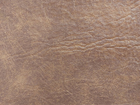 Textura de livro de capa dura feita de couro sint&eacute;tico marrom. Couro marrom colado sobre papel&atilde;o