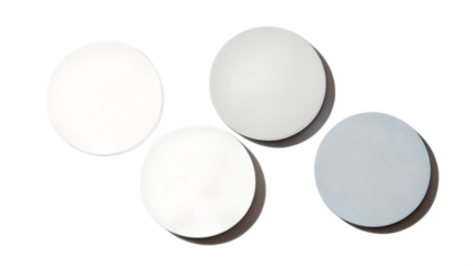 Four round white and grey discs are arranged on a transparent background