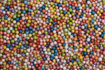 Multicolor foam plastic small bubble ball texture background.