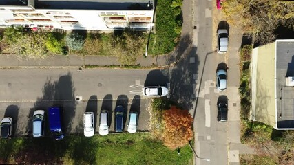 Top camera view of a car stopping perfectly at a stop sign