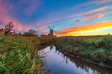 Cley Windmill at sunset in the village of Cley, Norfolk, UK