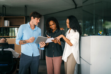 A diverse, talented team collaborates effectively in a bright office space during a business meeting