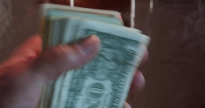 Cash Handling &ndash; US Currency on Luxurious Golden Backdrop | 4K, 12 bit Video