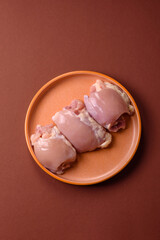Raw chicken thigh fillet without skin and bone with salt and spices. Raw chicken fillet for cooking