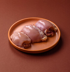 Raw chicken thigh fillet without skin and bone with salt and spices. Raw chicken fillet for cooking