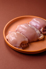 Raw chicken thigh fillet without skin and bone with salt and spices. Raw chicken fillet for cooking