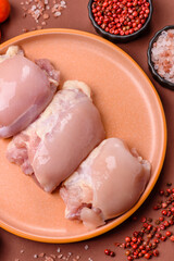 Raw chicken thigh fillet without skin and bone with salt and spices. Raw chicken fillet for cooking