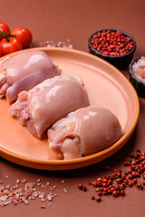 Raw chicken thigh fillet without skin and bone with salt and spices. Raw chicken fillet for cooking