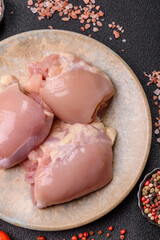 Raw chicken thigh fillet without skin and bone with salt and spices. Raw chicken fillet for cooking