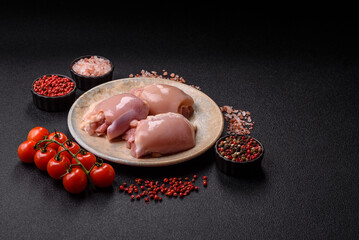 Raw chicken thigh fillet without skin and bone with salt and spices. Raw chicken fillet for cooking