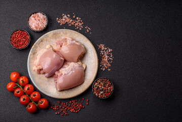 Raw chicken thigh fillet without skin and bone with salt and spices. Raw chicken fillet for cooking