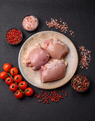Raw chicken thigh fillet without skin and bone with salt and spices. Raw chicken fillet for cooking