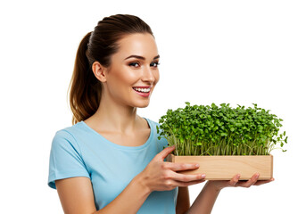 Woman demonstrates her hobby, holding a box of microgreens isolated on white