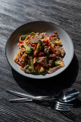 Pasta with beef, mushrooms and vegetables. 