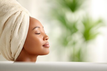 Relaxed Woman with Towel in Spa Setting