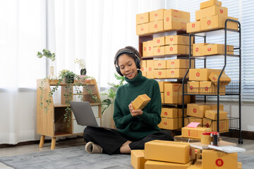 Independent young Asian women work at home and start SME entrepreneurs with online internet. Who...