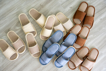 Cozy Comfort: A collection of stylish slippers in various hues offers a sense of warmth and...