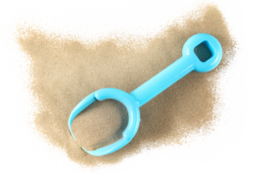 Plastic blue shovel, beach toy for kids in sand, isolated on white background, top view