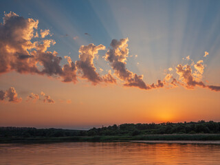 landscape with river and sun beams after sunset with copy space