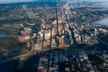 Fototapeta premium Richmond, Virginia - aerial view of the downtown district of Richmond, Virginia with broad street, i-95, the james river and shockoe bottom.