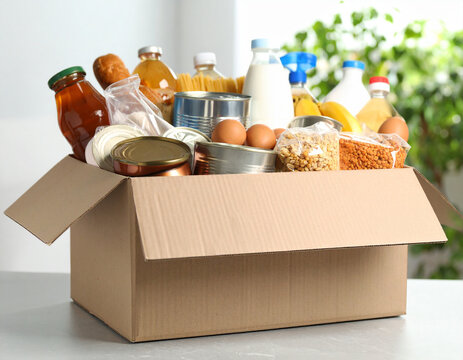 A collection of various non-perishable food items neatly stacked in a generic donation bin, ready for distribution.
