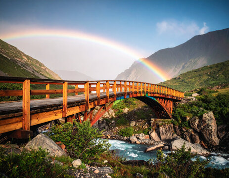 A vibrant abstract rainbow bridge connecting two disparate, blurred landscapes, representing bridging divides and access.