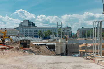 Construction thrives at Ljubljana Train Station on a bright July day in 2025. Excavators dig,...