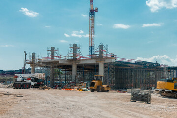 A bustling construction site near Ljubljana Train Station rises under a clear July 2025 sky....