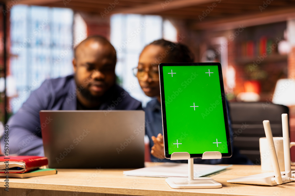 Poster african american couple browse troubleshooting online guide next to chroma key, working together to 